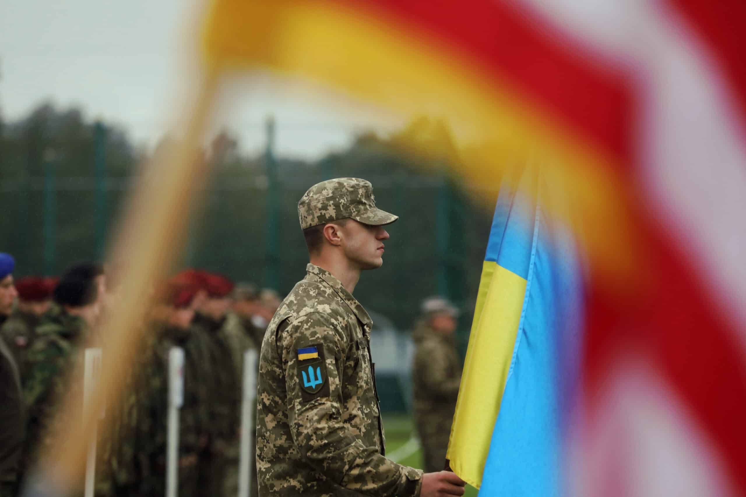 Ukrainian soldier stands at the front of his formation