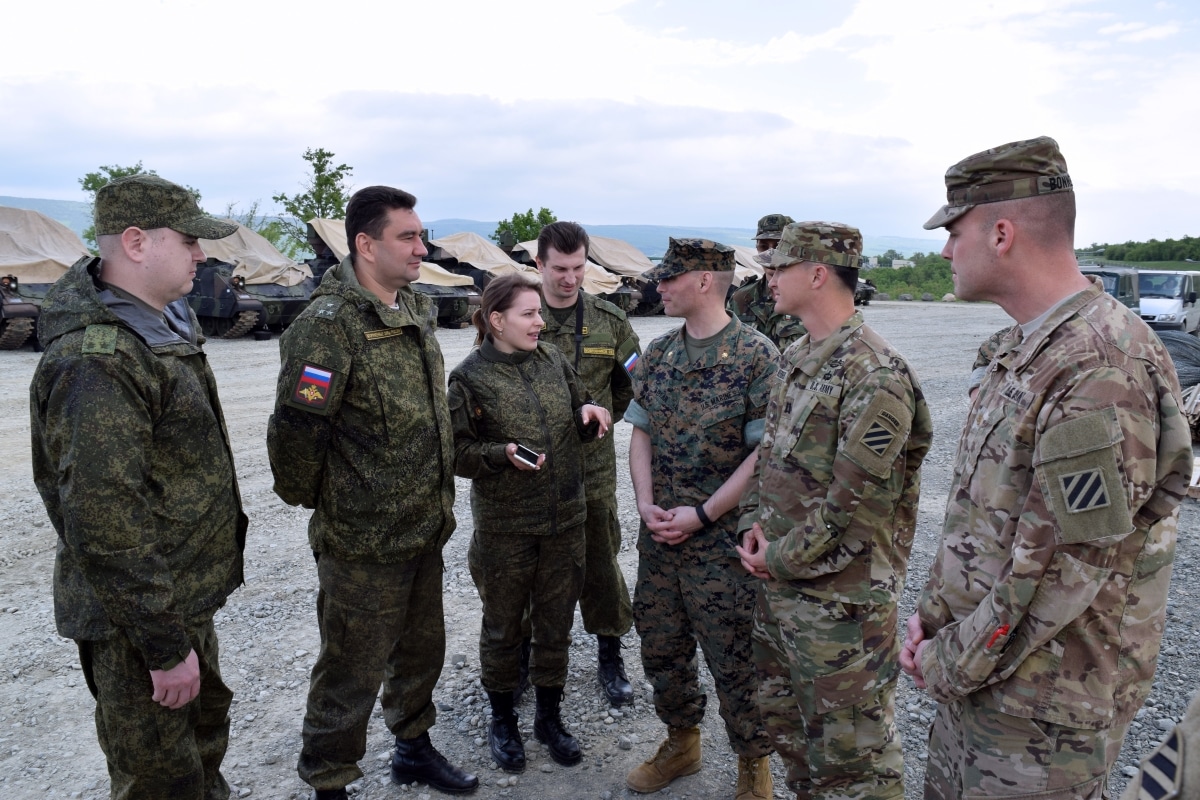 Soldiers from 1st Battalion, 64th Armor Regiment meet with a Russian inspection team at Bulgaria's Novo Selo Training Area