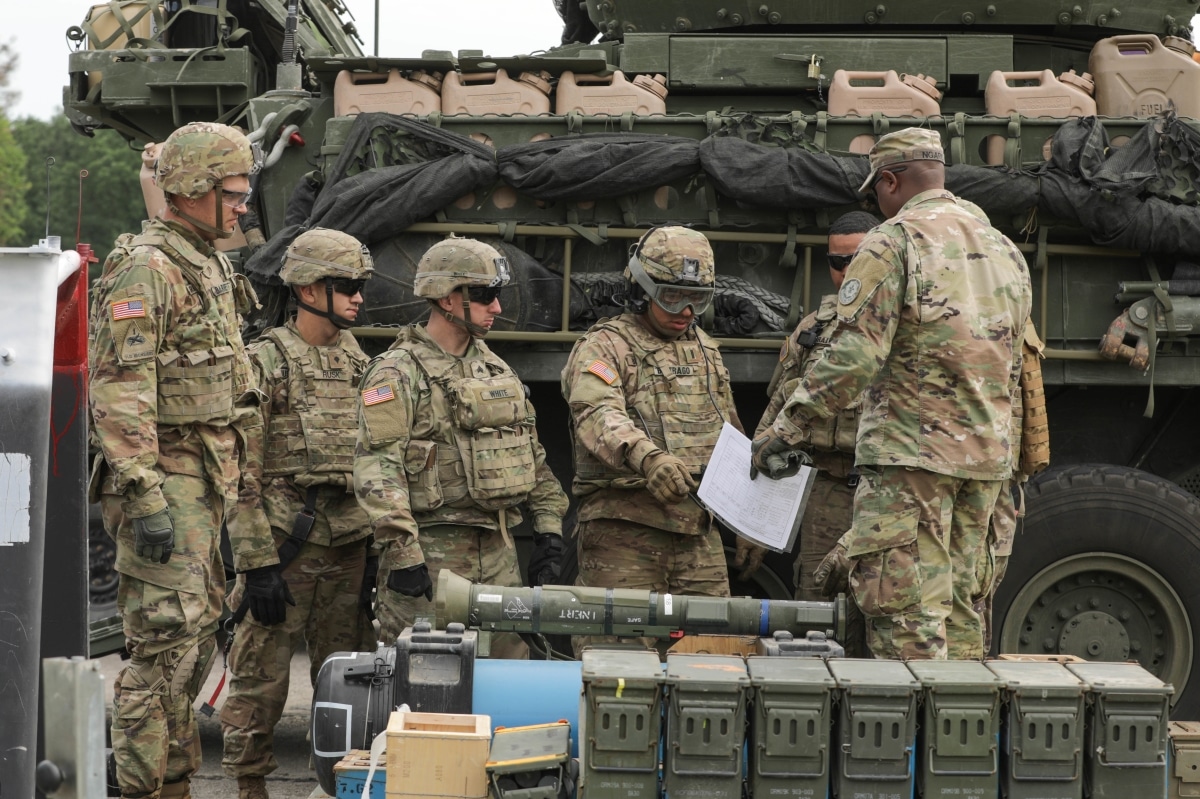A Stryker crew from the 4th Squadron, 2d Cavalry Regiment prepares to receive a simulated full combat load of ammunition