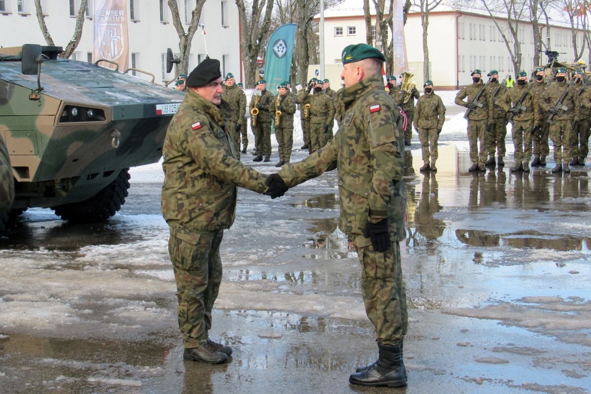 Special guest General Jaroslaw Mika, head of Polish Armed Forces, shakes the hand of one of his commanders during the enhanced Forward Presence Battle Group Poland change of command ceremony