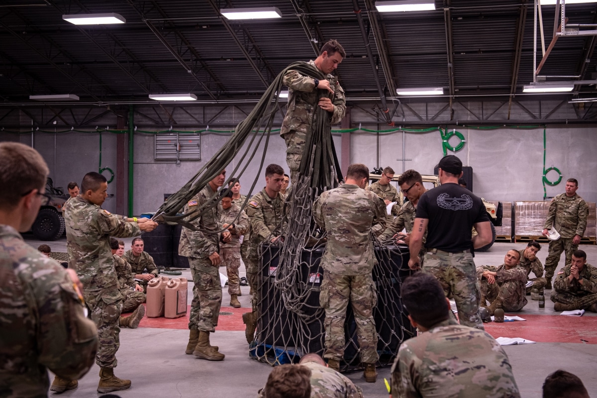 Air Assault students prepare equipment and supplies for sling load operations during training