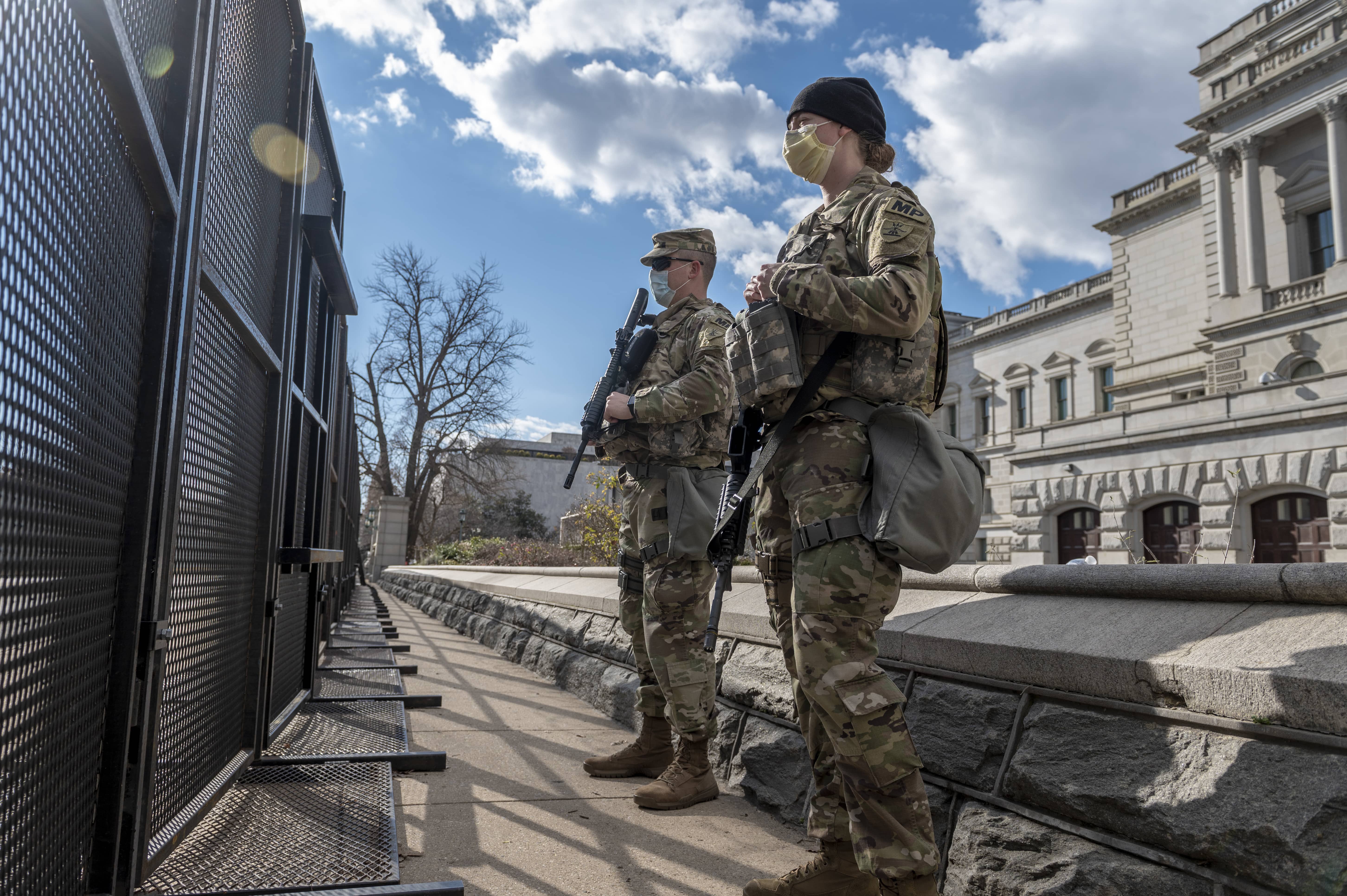 the 191st Military Police Company, North Dakota National Guard, stand guard near the Library of Congress in Washington, D.C