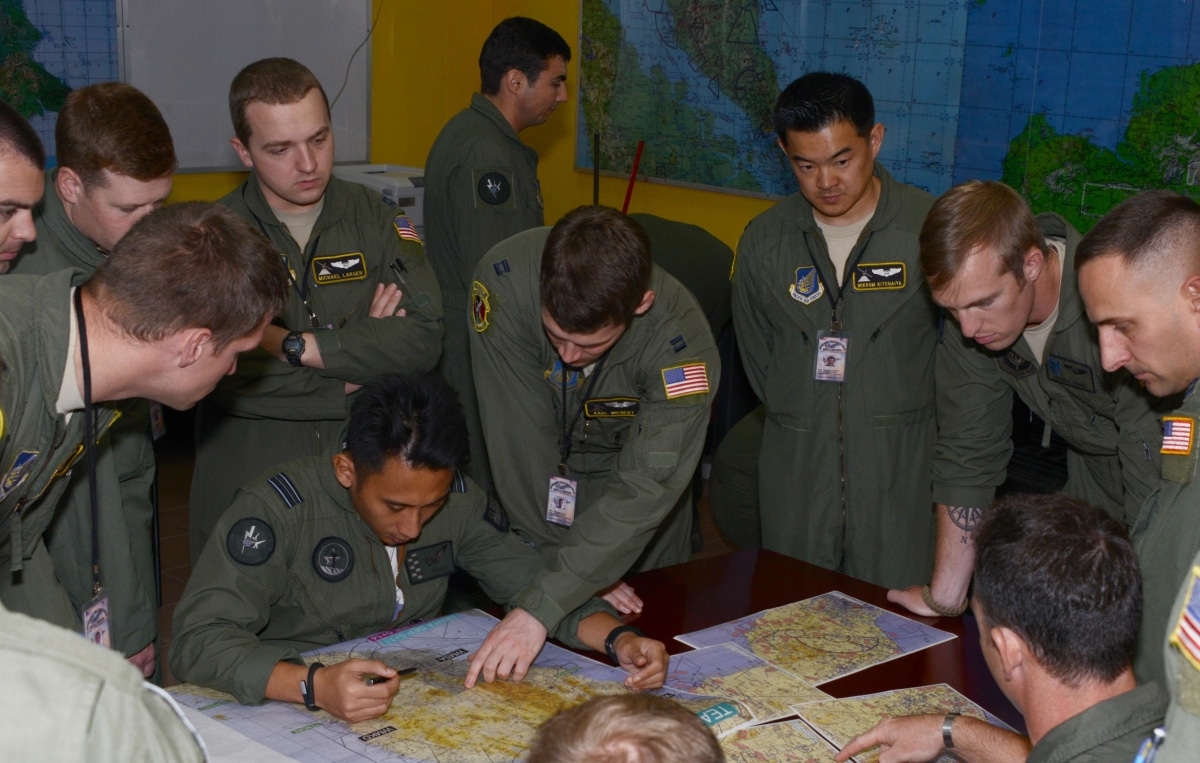 A Royal Malaysian Air Force pilot familiarizes crews from the 36th Airlift Squadron and the 17th Special Operations Squadron