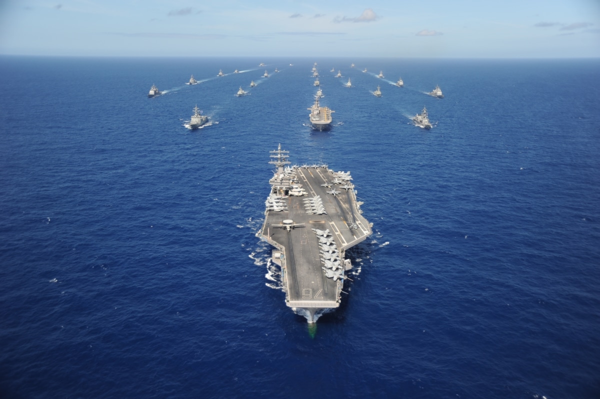 The Nimitz-class aircraft carrier USS Ronald Reagan leads a mass formation of ships from Korea, Taiwan, Japan, Singapore, France, Canada, Australia and the U.S. during Rim of the Pacific