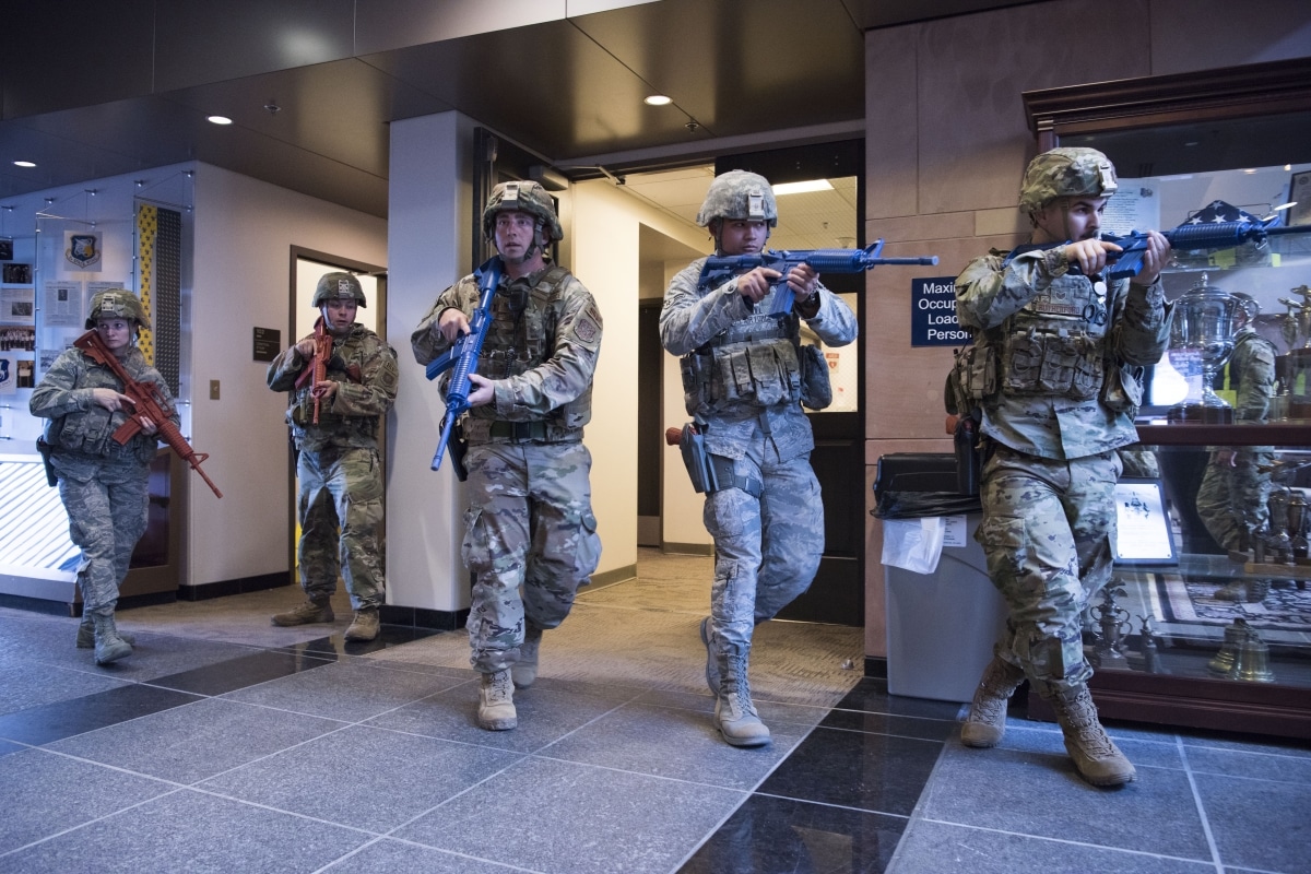 SCHRIEVER AIR FORCE BASE, Colo.--50th Security Force Squadron response force team moves to clear a building in a simulated active shooter scenario during a field training exercise