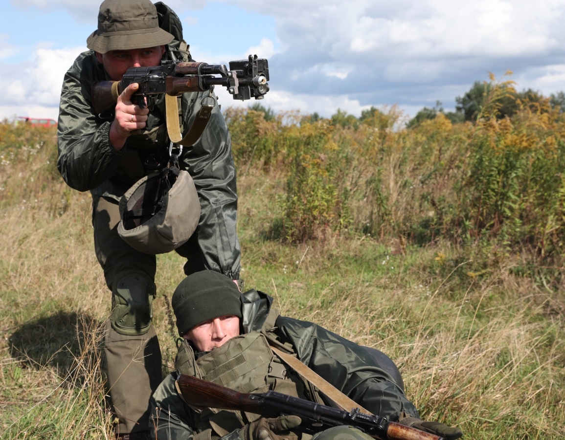 A Ukraine soldier simulates relocating casualties while under fire during the medical situational training exercise as part of Rapid Trident