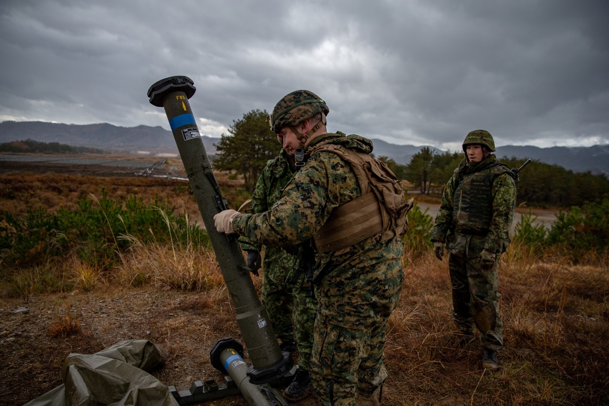 Soldiers with 8th Infantry Regiment, Japan Ground Self-Defense Force, demonstrate an anit-tank missile Type 87 to U.S. Marine Maj. Mark Capansky Jr., commanding officer of Company A,