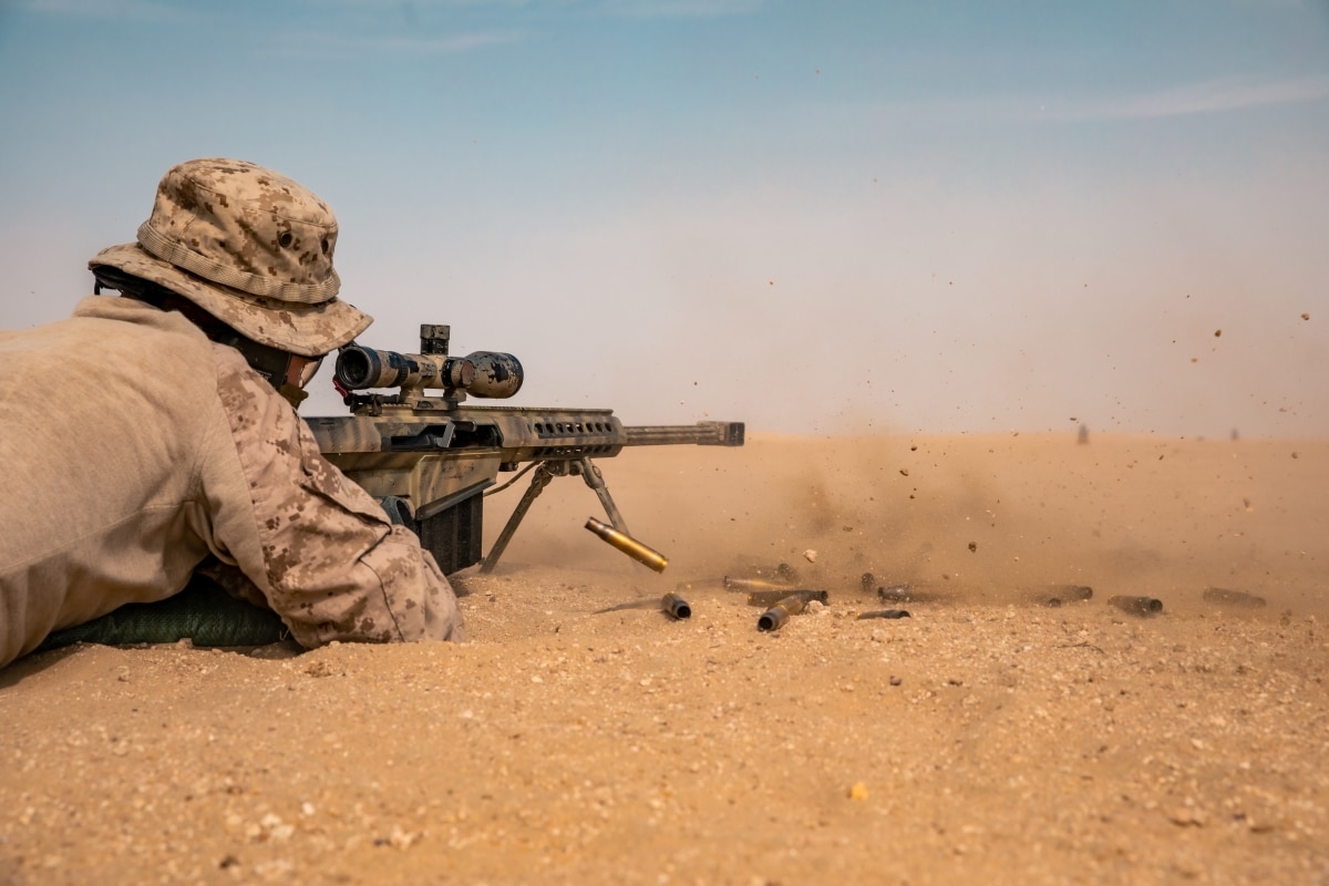 A U.S. Marine with 3rd Battalion, 1st Marine Regiment, assigned to the Special Purpose Marine-Air Ground Task Force – Crisis Response - Central Command, fires an M107 Semi-Automatic Long Range sniper rifle during a live-fire unknown distance range in Kuwait