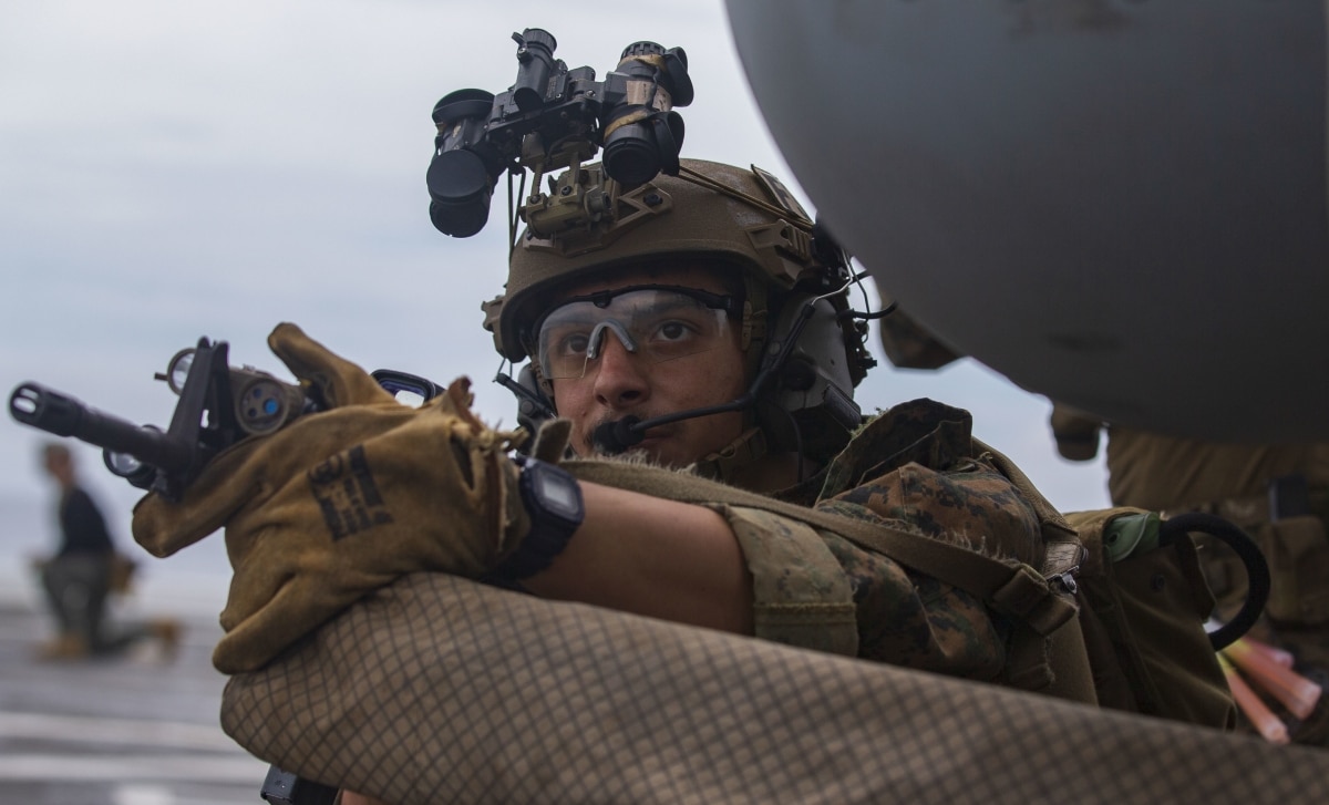 U.S. Marine with Force Reconnaissance Platoon (FRP), 31st Marine Expeditionary Unit (MEU), provides security during a raid, aboard the amphibious assault ship USS New Orleans