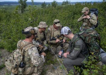 U.S. Army Green Berets from Alpha Company, 3rd Battalion, 20th Special Forces Group (Airborne) discuss their plan for exfiltration during a personnel recovery operation