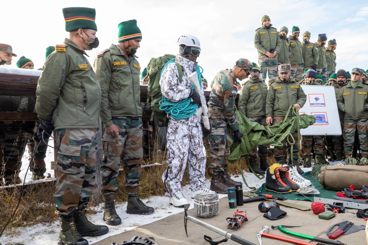 Indian Army Soldiers demonstrate the wear and use of their winter equipment to paratroopers with the 4th Infantry Brigade Combat Team