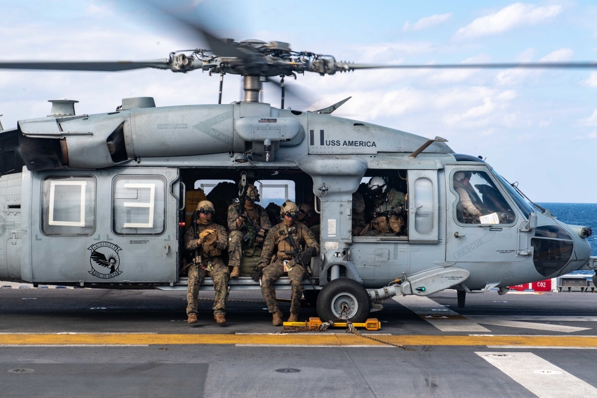 PHILIPPINE SEA (Feb. 5, 2022) Marines assigned to the 31st Marine Expeditionary Unit (MEU) prepare to disembark the forward-deployed amphibious assault ship USS America
