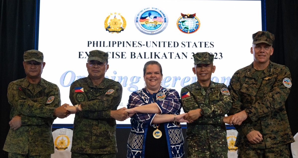 Philippine and U.S. government and military representatives conduct the “crossing of hands” handhold the opening ceremony to commence Balikatan 23 at Camp Aguinaldo, Manila, Philippines