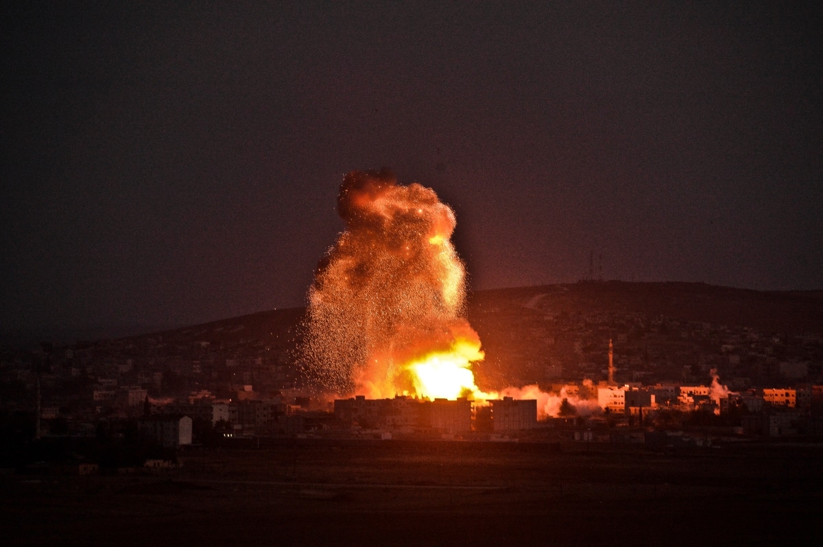 Smoke and flames rise following an explosion in the Syrian town of Kobane