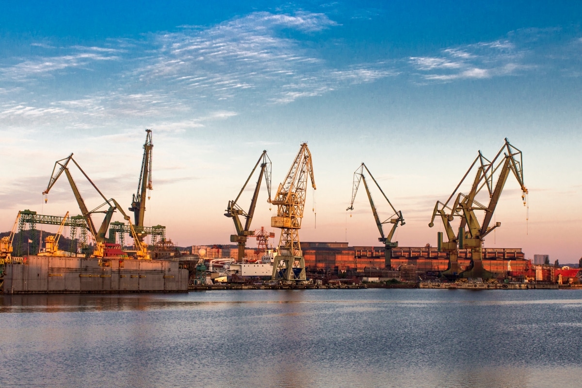 Morning landscape - view of the shipyard with historical cranes in the industrial part of the city Gdansk (Gdańsk) in Poland (Polska).