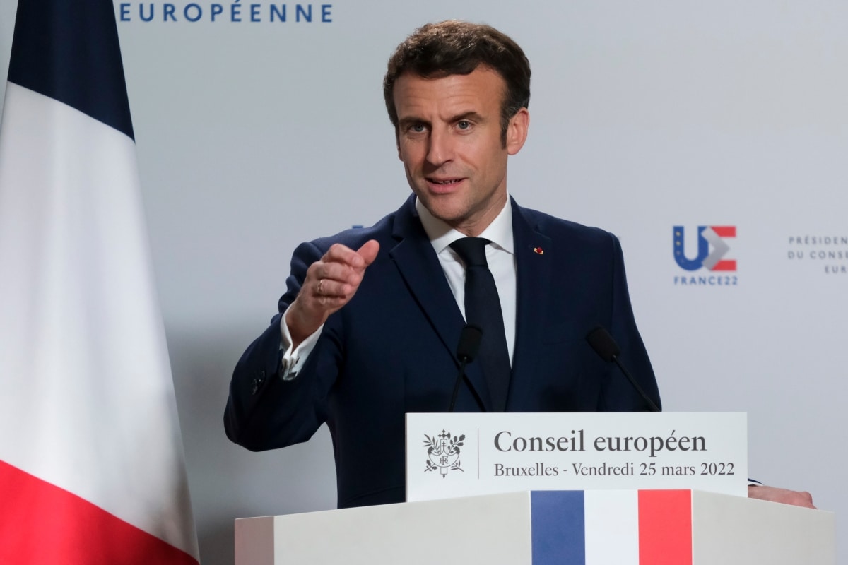 French President Emmanuel Macron gestures as he speaks to the media after European Union leaders' summit, amid Russia's invasion of Ukraine, in Brussels, Belgium