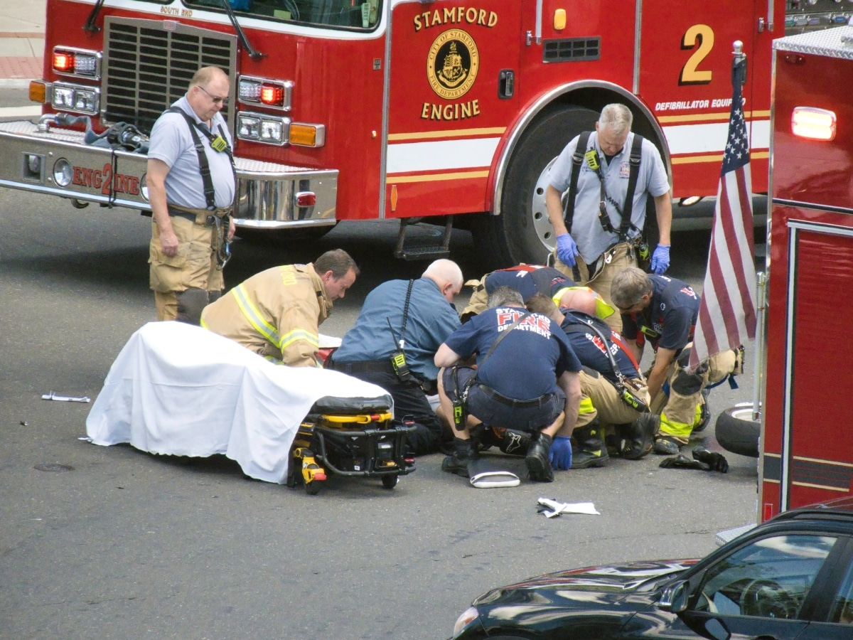 Stamford, Connecticut USA - June 10, 2022: Stamford First Responders attend to injured motorcyclist in Downtown Stamford.