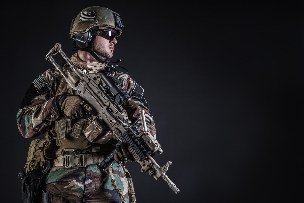 United states Marine Corps special operations command Marsoc raider with weapon. Studio shot of Marine Special Operator