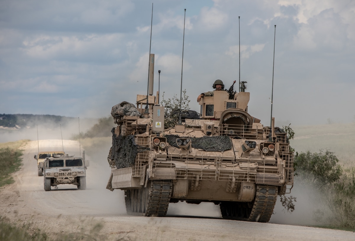 Soldiers from 4th Squadron, 9th U.S. Cavalry Regiment "Dark Horse," 2nd Armored Brigade Combat Team, 1st Cavalry Division, are escorted by observer controllers from the U.S. Army Operational Test Command after completing field testing of the Armored Multi-Purpose Vehicle (AMPV) Sept. 24. (Photo Credit: Maj. Carson Petry (1st CAV))