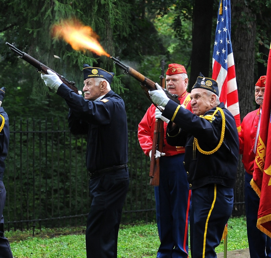 Members of the Fremont Veterans of Foreign Wars Post 2947 and Fremont American Legion Post 121 fire a 21 gun salute in honor of former President Rutherford B