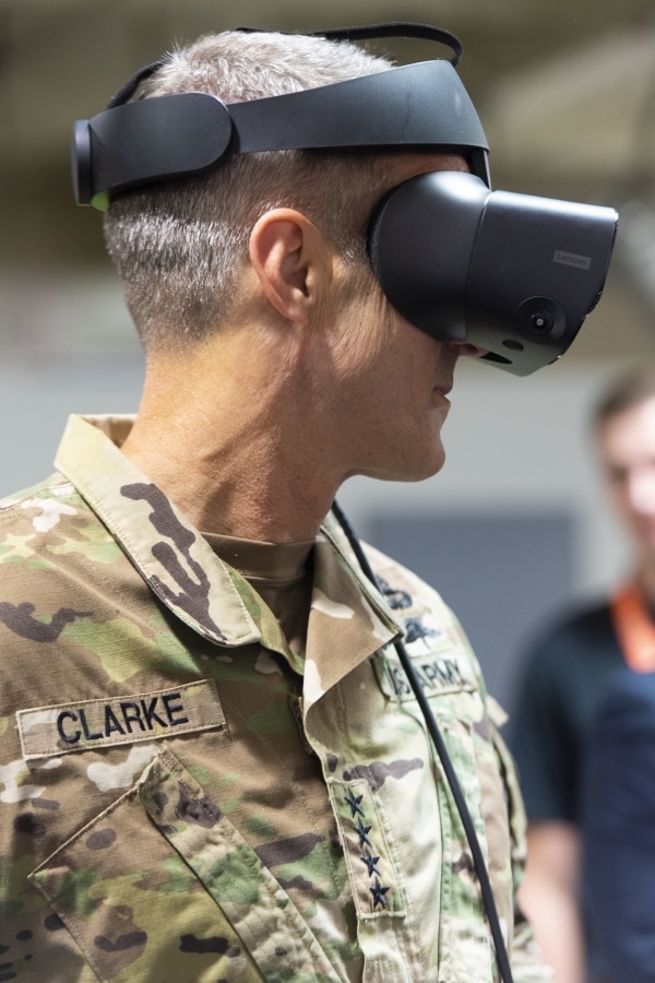 Gen. Richard D. Clarke, commander, U.S. Special Operations Command, samples virtual reality technology before the USSOCOM Data Engineering Lab grand opening ceremony
