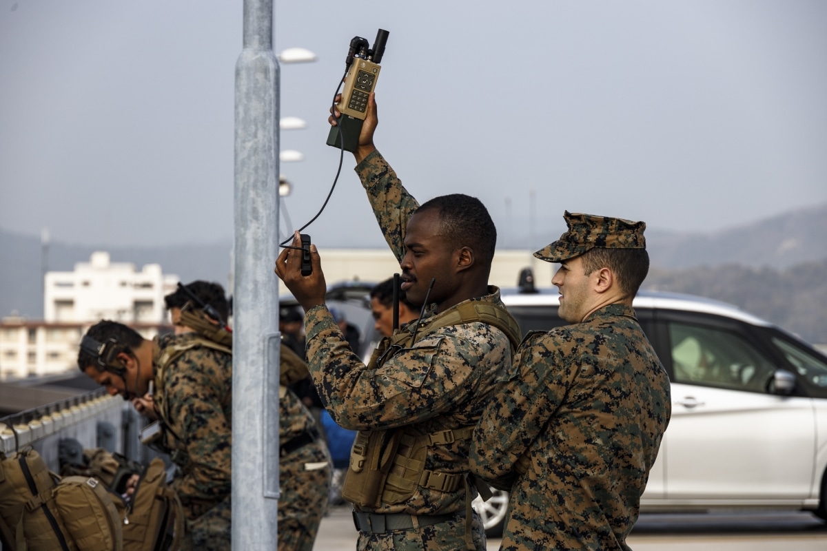 U.S. Marines with 5th Air Naval Gunfire Liaison Company (ANGLICO), III Marine Expeditionary Force Information Group, prepare for close air support
