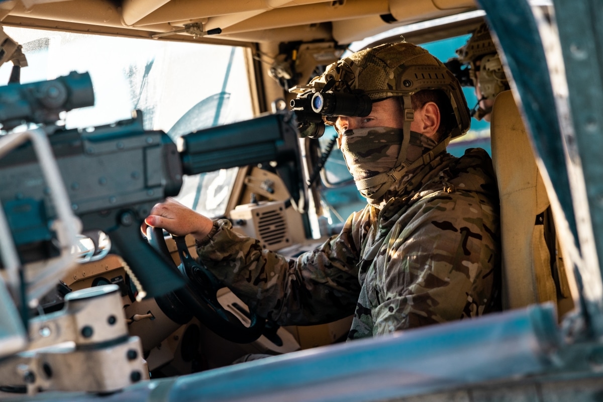 A United Kingdom Royal Marine from 45 Commando sits behind the wheel of an M1288 GMV 1.1 light utility vehicle while conducting training mission rehearsals at Grafenwöhr Training Area, Germany