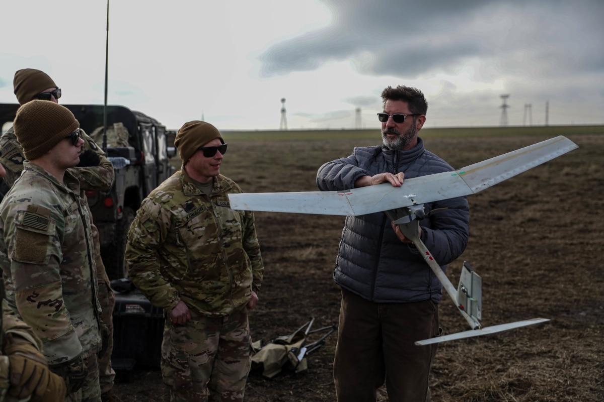 Shad Babb, a Lead Field Support Representative for AeroVironment Inc. instructs Soldiers on improvements that are being made on the RQ-11B Drone or "Raven" at one of the multiple forward operating sites in Romania