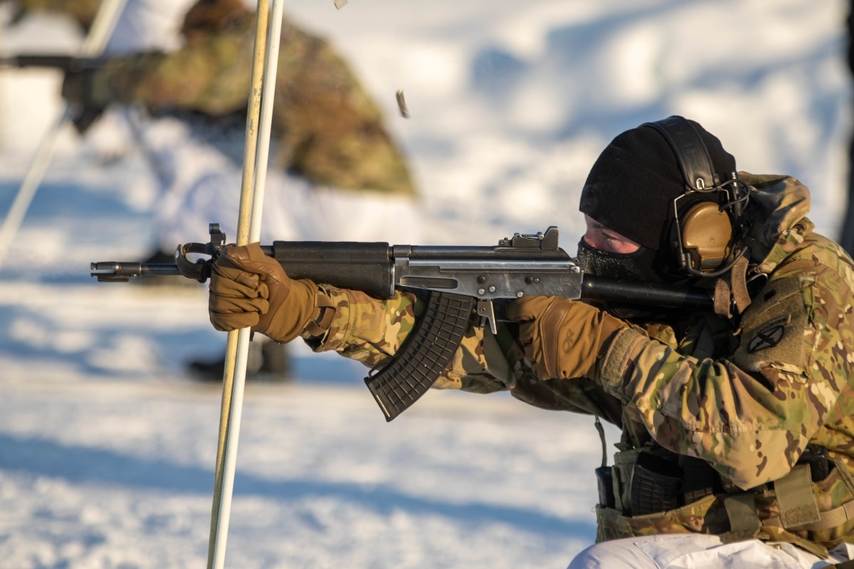 Spc. Cade Ross, from Charlie Troop, 3-71 Cavalry Regiment, 1st Brigade Combat Team, 10th Mountain Division, shoots range targets at 50 meters with the RK62 on skis in the kneeling position during Exercise Arctic Forge in Sodankyla Garrison, Finland on Feb. 22, 2023. Exercise Arctic Forge 23 is a U.S. Army Europe and Africa led umbrella