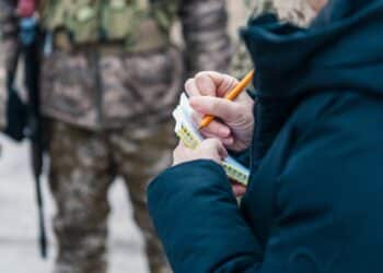 KYIV REGION, UKRAINE - MARCH 2022. Foreign journalists interview Ukrainian soldiers.