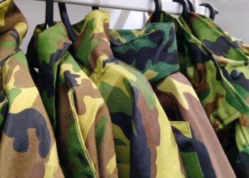 Military clothing on a hanger for military personnel or for fishermen and hunters. Military uniform. camouflage
