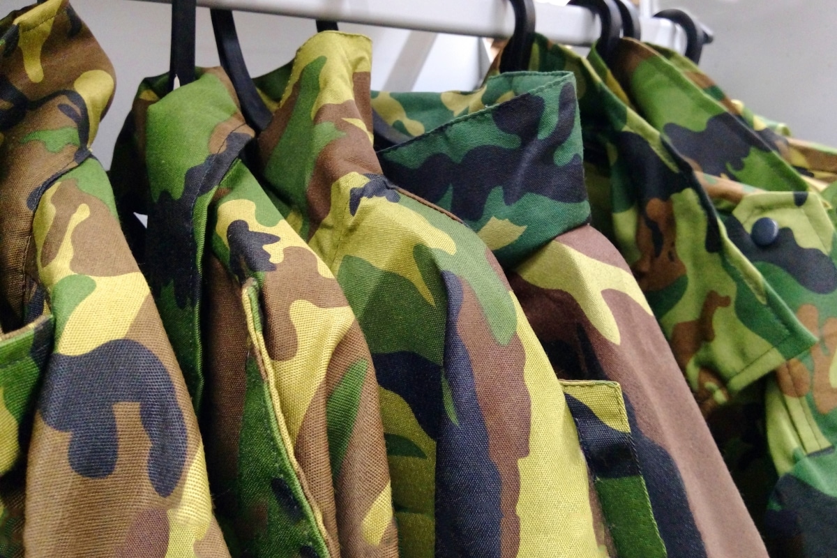 Military clothing on a hanger for military personnel or for fishermen and hunters. Military uniform. camouflage
