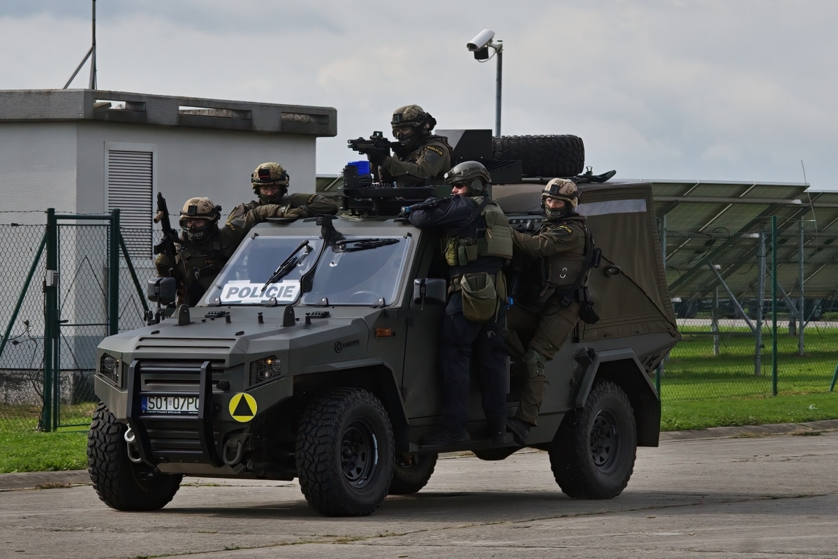 Ostrava, Czech republic - september 17 2022: Police officers from the special intervention unit on an armored vehicle