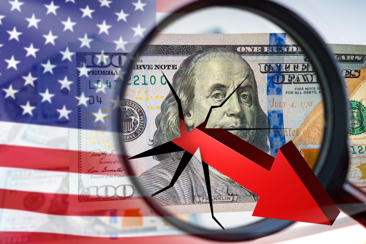 Financial crisis in USA. Dollars near flag of america. Arrow down is under magnifying glass. Inflation crisis of american economy. Collapse of USA stock market. Recession, depression.