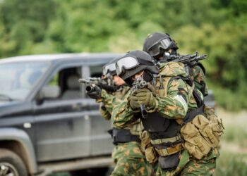 Russian special forces operators in uniform and bulletproof vest and helmets Russian special forces operators in uniform and bulletproof vest and helmets