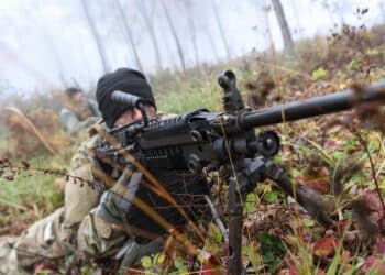 U.S. Army Pfc. Bobby Taylor, a Greenfield, Ind. soldier assigned to the 1st Squadron, 152nd Cavalry Regiment, 76th Infantry Brigade Combat Team, 38th Infantry Division, Indiana Army National Guard, mans an M249 light machine gun during a reconnaissance and surveillance rehearsal exercise