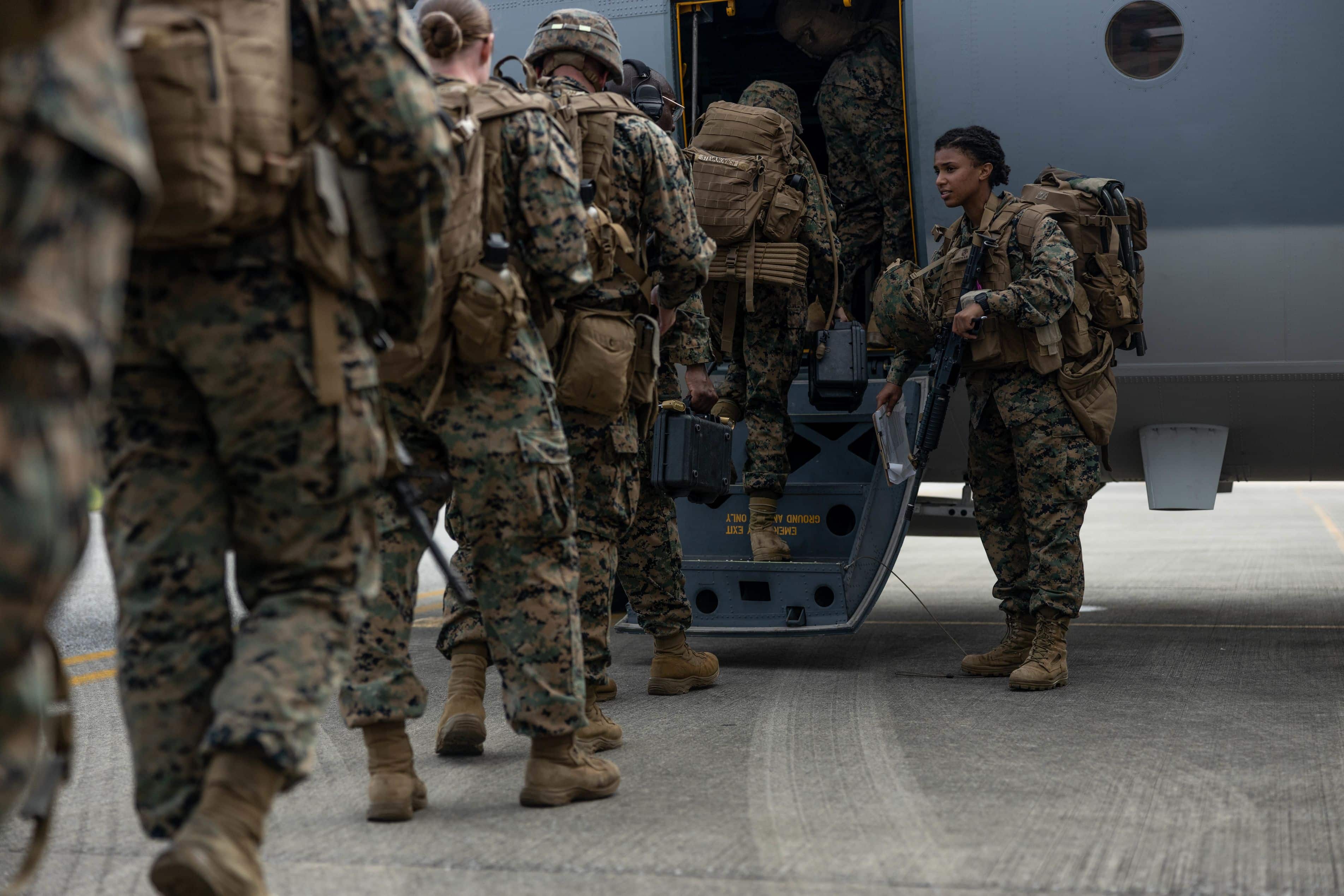 U.S. Marines with 3d Marine Division board a KC-130J Super Hercules during an Alert Contingency Marine Air-Ground Task Force (ACM) drill on Okinawa, Japan, initiating the deployment of the Division’s Forward Command