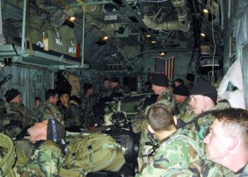 Green Berets assigned to 10th Special Forces Group (Airborne) sat in the back of an MC-130H fly along the western border of Iraq during the mission Ugly Baby