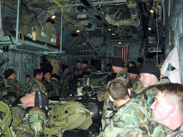 Green Berets assigned to 10th Special Forces Group (Airborne) sat in the back of an MC-130H fly along the western border of Iraq during the mission Ugly Baby