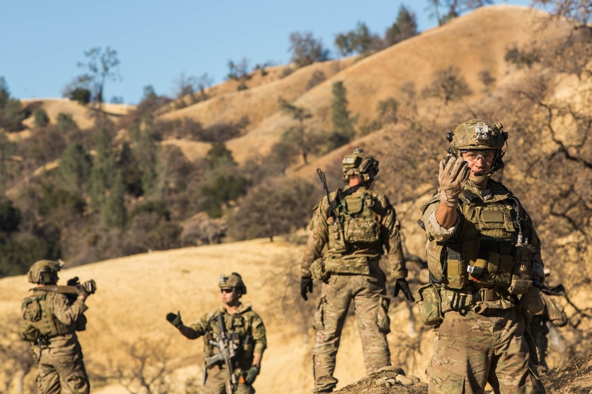 A U.S. Army Ranger assigned to 2nd Battalion, 75th Ranger Regiment, directs movement during a Task Force Training on Fort Hunter Liggett, Calif., Jan. 22, 2014. Rangers conduct rigorous training to maintain their tactical proficiency. (U.S. Army photo by Pfc. Rashene Mincy/ Released)