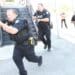 Detectives with the University of Utah Police Department respond to an active-shooter training simulation at Fort Douglas, Utah, July 17, 2014. In the event of a real-life situation, this training helps to prepare civilians, military personnel and the police department alike.