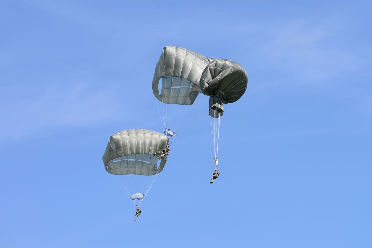 U.S. Army paratroopers with the 173rd Airborne Brigade execute emergency procedures in response to a T-11 parachute system malfunction during airborne training above the Nella Drop Zone in Tuscany