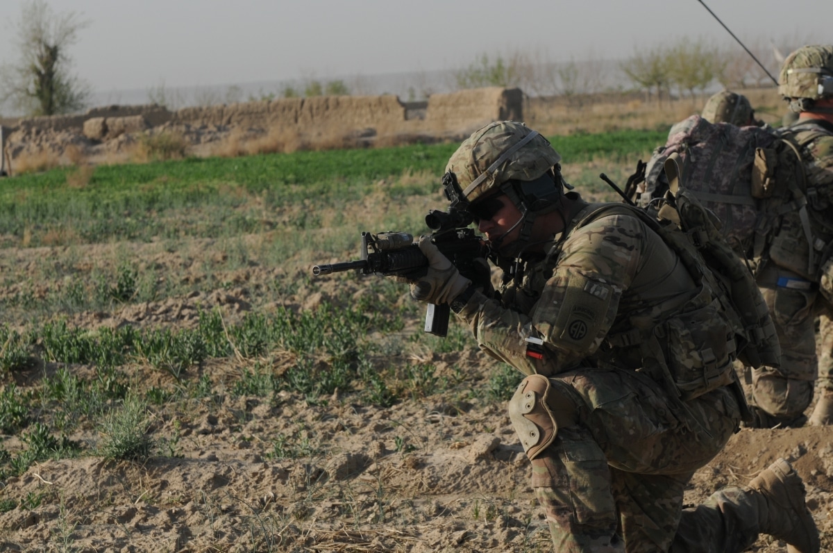 Sgt. 1st Class Douglas Queen, the platoon sergeant for 2nd Platoon, Alpha Company, 1st Battalion, 508th Parachute Infantry Regiment, 4th Brigade Combat Team, 82nd Airborne Division, pulls security while on patrol in Maiwand district, April 4. Alpha company provided the blocking element for Operation Sham Shir.