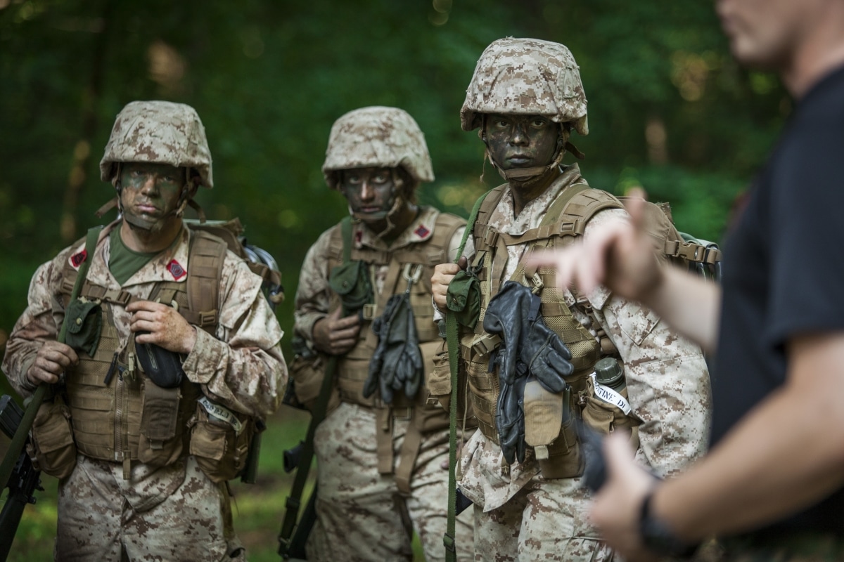 Officer candidates receive a brief from Cpl. Robert Toll during the Field Exercise (FEX) at Marine Corps Officer Candidates School aboard Marine Corps Base Quantico, Virginia