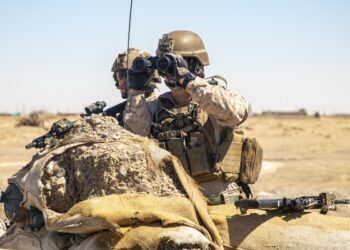 A U.S. Marine with Special Purpose Marine Air-Ground Task Force – Crisis Response – Central Command, and a U.S. Army soldiers with 2nd Brigade Combat Team