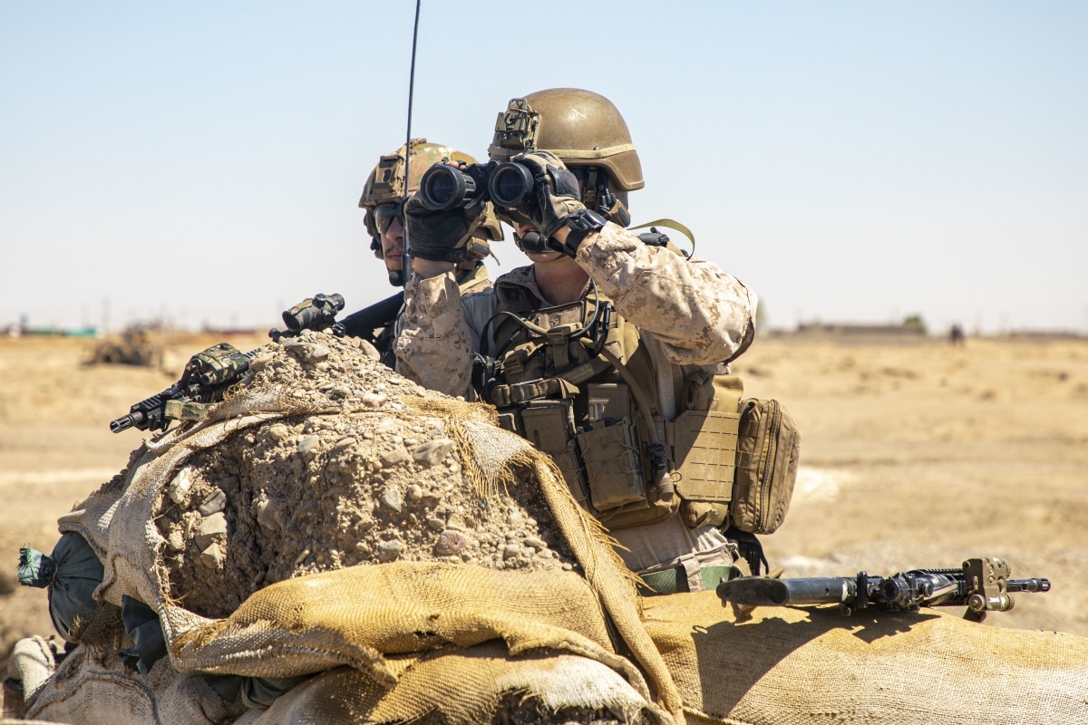 A U.S. Marine with Special Purpose Marine Air-Ground Task Force – Crisis Response – Central Command, and a U.S. Army soldiers with 2nd Brigade Combat Team