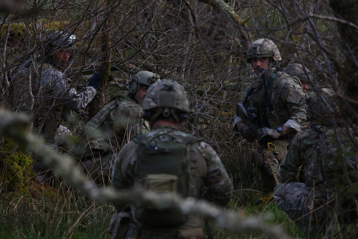Green Berets from the 5th Special Forces Group (Airborne) and Soldiers from the British Army 4 Rifles, prepare to assault in objective at a training area in Brecon, UK. The assault was part of joint exercise “Bold Legion” which brought the two teams together for building the foundation of an ongoing relationship.