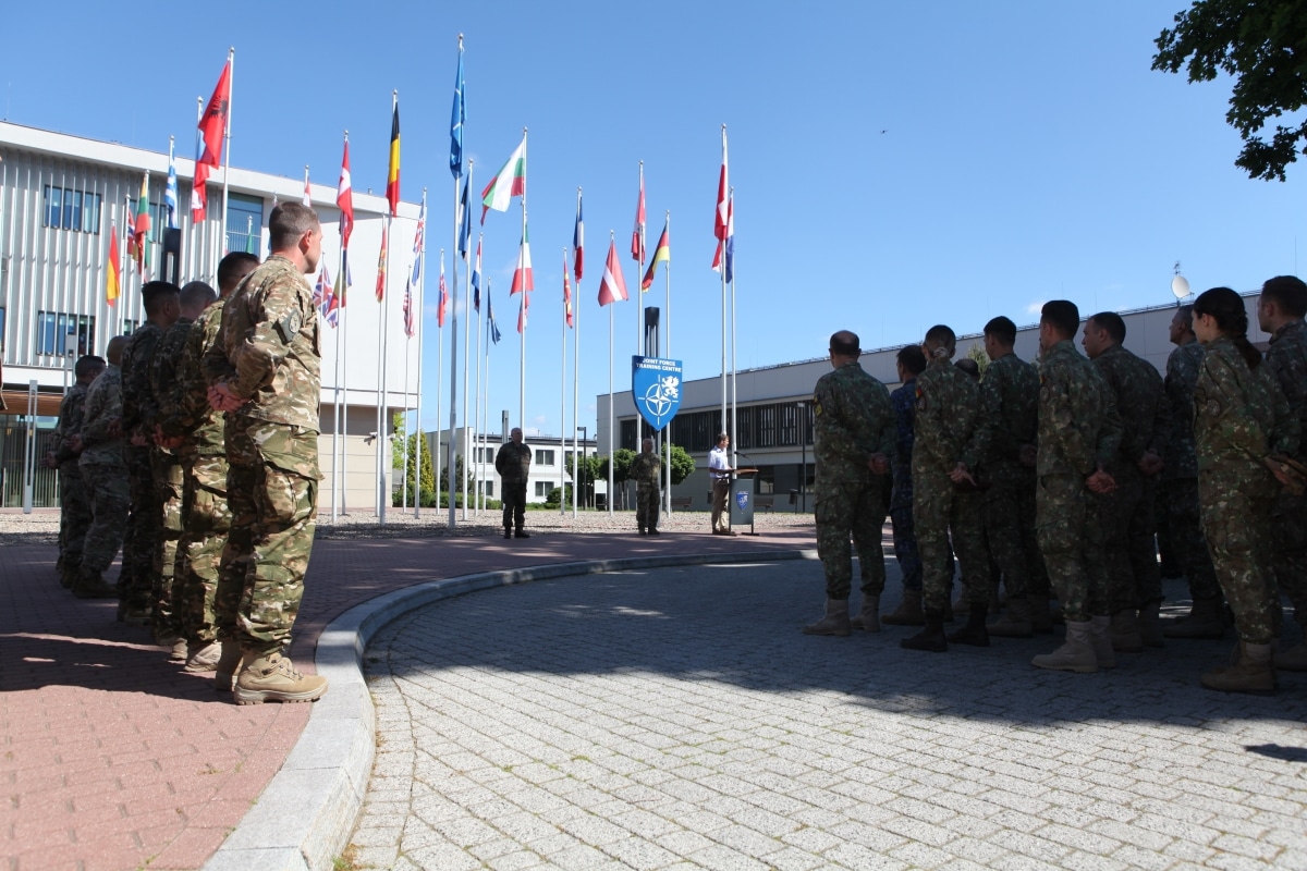 NATO participants stand in formation during the opening day ceremony of CWIX 2021 on June 9th, 2021 at Joint Force Training Centre at Bydgoszcz, Poland.
