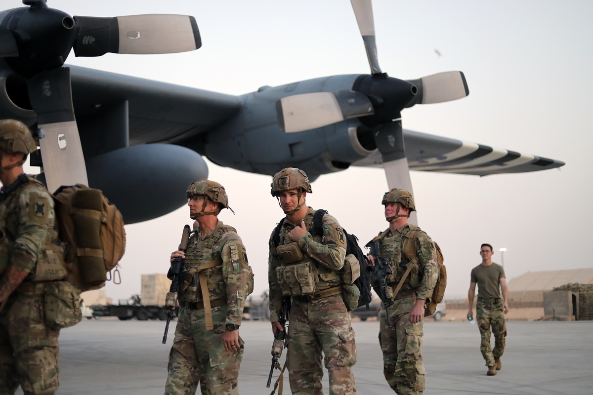 A platoon of Soldiers from the 256th Infantry Brigade Combat Team, Louisiana National Guard, board a U.S. Air Force flight leaving Al Asad Air Base in western Iraq