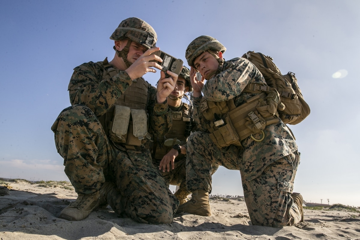 From left, U.S. Marine Corps Sgt. Christopher N. Lupyak, Lance Cpl. Joseph Burns, and Lance Cpl. Nolan Jaros, all combat engineers with the Littoral Engineer Reconnaissance Team, 9th Engineer Support Battalion